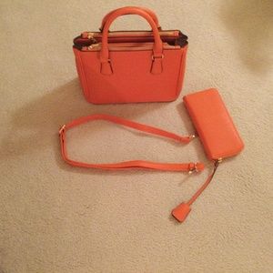 Satchel bag with zip top. Zip around wallet  rich orang color.